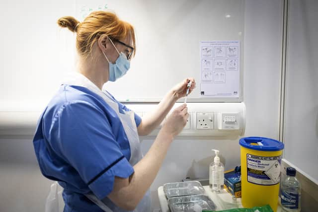 A nurse prepares a Covid-19 vaccine. Picture: PA Media