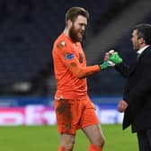 St Johnstone manager Callum Davidson congratulates goalkeeper Zander Clark after the 3-0 win over Hibs at Hampden.