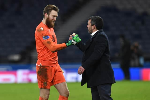 St Johnstone manager Callum Davidson congratulates goalkeeper Zander Clark after the 3-0 win over Hibs at Hampden.