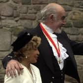Sir Sean Connery  accompanied by his wife, Micheline at his investiture at the Palace of Holyrood.