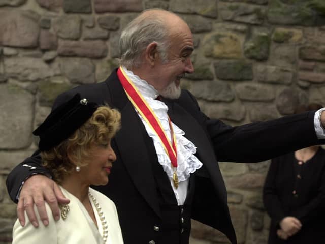 Sir Sean Connery  accompanied by his wife, Micheline at his investiture at the Palace of Holyrood.