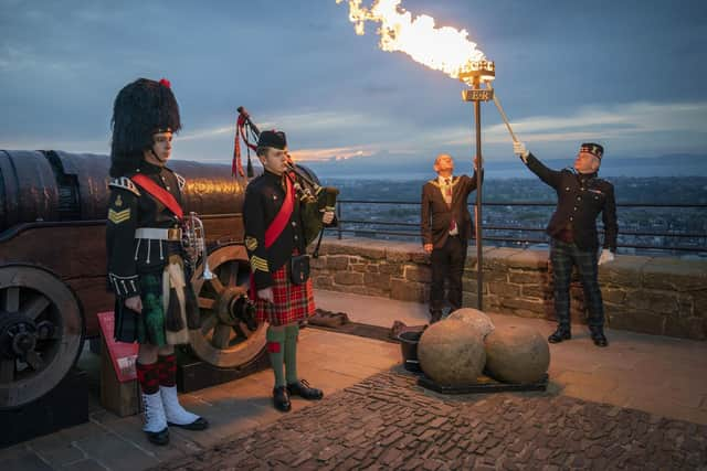 A Platinum Jubilee beacon is lit by Lord Provost Robert Aldridge and Commander of Edinburgh Garrison Lieutenant Colonel Lorne Campbell at Edinburgh Castle