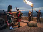 A Platinum Jubilee beacon is lit by Lord Provost Robert Aldridge and Commander of Edinburgh Garrison Lieutenant Colonel Lorne Campbell at Edinburgh Castle