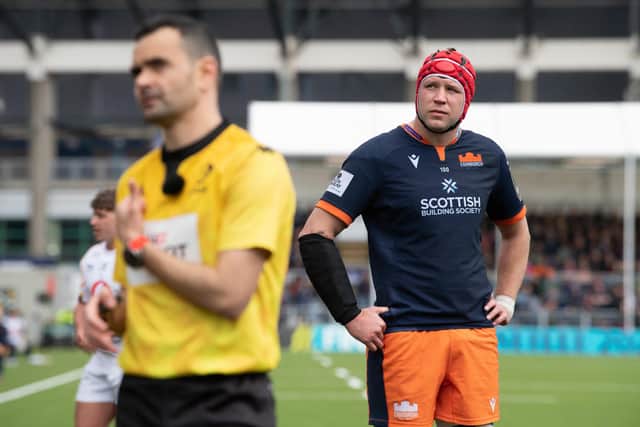 Edinburgh captain Grant Gilchrist watches on as referee Pierre Brousset watches replays of the Henry Pyrgos incident on the big screen at the DAM Health Stadium. (Photo by Ross Parker / SNS Group)