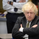 Boris Johnson pictured on a constituency visit after the by-election drubbing last week