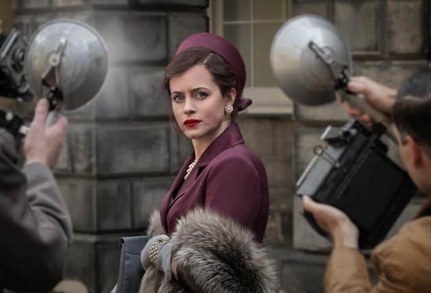 Claire Foy as the Duchess of Argyll faces a barrage of Press photographers in the BBC drama A Very British Scandal