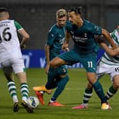 Hearts target Aaron McEneff (No.10) tussles with AC Milan's Zalatan Ibrahimovic earlier this season. Pic: Getty Images.