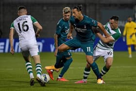 Hearts target Aaron McEneff (No.10) tussles with AC Milan's Zalatan Ibrahimovic earlier this season. Pic: Getty Images.