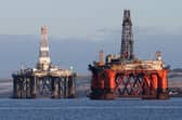 An oil platform standing amongst other rigs. PIC: Andrew Milligan/PA Wire