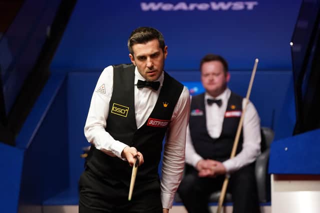Mark Selby lines up a shot during the Betfred World Snooker Championship final against Shaun Murphy at the Crucible.