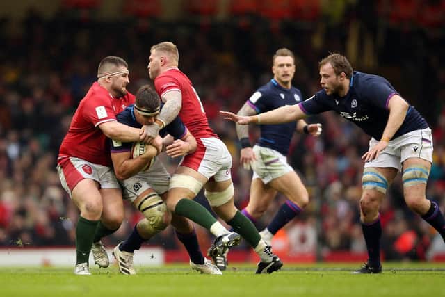 Sam Skinner, pictured with ball, is likely to switch from flanker to lock to replace the injured Jonny Gray, right, against France. Picture: Nigel French/PA