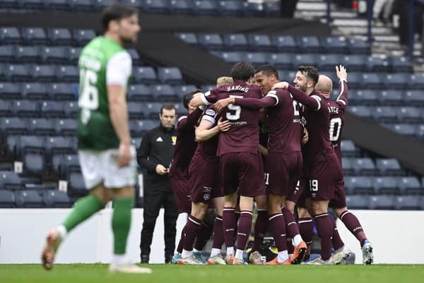 The Hearts players celebrate going 2-0 up against Hibs.