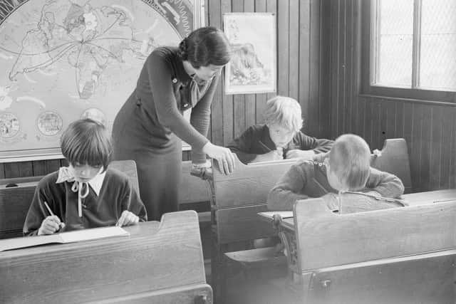 Decades ago Scottish children proved accomplished pupils, says reader. Here Miss Williams is seen teaching in the smallest school in Britain, in Tweedsmuir. Nine-year-old Bobby and ten-year-old sister Margaret Smith make up the class with eight-year-old Neill McKellar (Picture: Martin/Fox Photos/Getty Images)