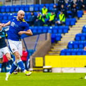 St Johnstone's Chris Kane scores his side's opener in the 3-1 defeat of Dundee - unusually both sides were allowed to play in blue (Photo by Roddy Scott / SNS Group)