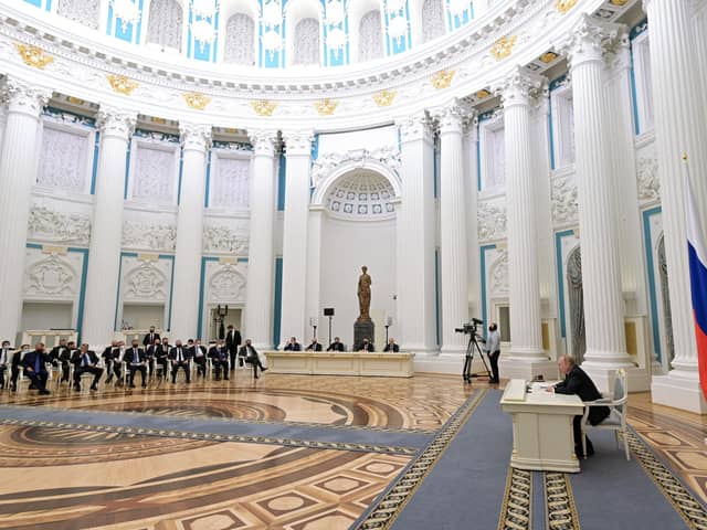 Vladimir Putin chairs a meeting of business leaders at the Kremlin yesterday, at which he said he wanted Russia to remain part of the world economy (Picture: Alexey Nikolsky/Sputnik/AFP via Getty Images)