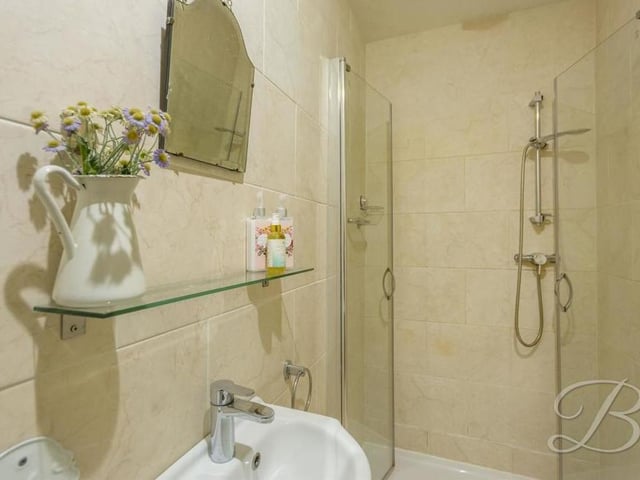 A second view of the en suite to the master bedroom, with its walk-in shower.