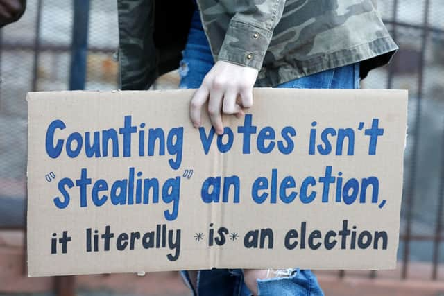 A protestor who wants every vote cast in the 2020 presidential election to be counted takes part in a demonstration in Detroit, Michigan, after Donald Trump called for this to stop (Picture: Jeff Kowalsky/AFP via Getty Images)