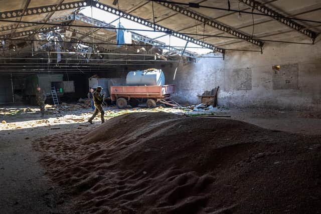Ukrainian soldiers inspect a grain warehouse shelled by Russian forces near the frontlines of Kherson Oblast in Novovorontsovka (Picture:John Moore/Getty Images)