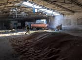 Ukrainian soldiers inspect a grain warehouse shelled by Russian forces near the frontlines of Kherson Oblast in Novovorontsovka (Picture:John Moore/Getty Images)