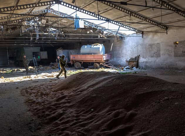 Ukrainian soldiers inspect a grain warehouse shelled by Russian forces near the frontlines of Kherson Oblast in Novovorontsovka (Picture:John Moore/Getty Images)