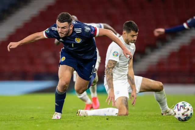 John McGinn (left) is fouled by Israel's Nir Bitton (Photo by Craig Williamson / SNS Group)