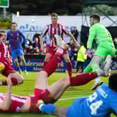 St Johnstone's Liam Gordon blocks a late chance for Inverness striker Billy McKay during the 2-2 draw in the Premiership play-off final 1st leg. (Photo by Ross Parker / SNS Group)