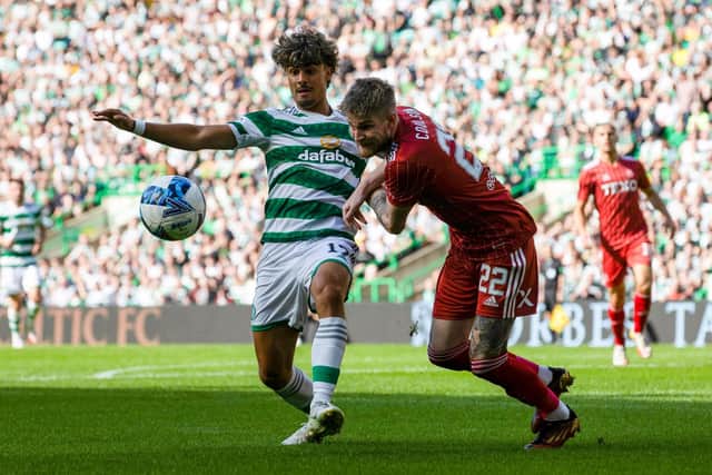 New Aberdeen defender Hayden Coulson had his work cut out against Celtic forward Jota.