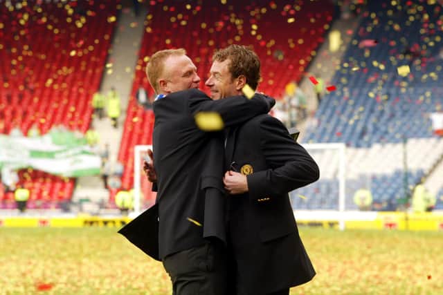 Rangers manager Alex McLeish involves Bert Konterman (right) in the celebrations after the 2002 Scottish Cup final win over Celtic.
