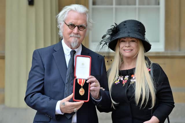 Sir Billy Connolly poses with his wife Pamela Stephenson, after being knighted by the Duke of Cambridge during an Investiture ceremony at Buckingham Palace in 2018. Picture: John Stillwell - WPA Pool / Getty Images