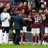 Hearts players give announcer Scott Wilson a guard of honour as he departs the club after 20 years.