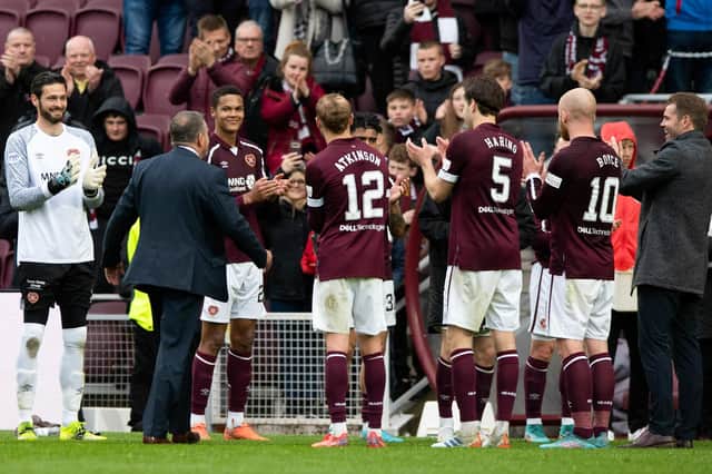 Hearts players give announcer Scott Wilson a guard of honour as he departs the club after 20 years.