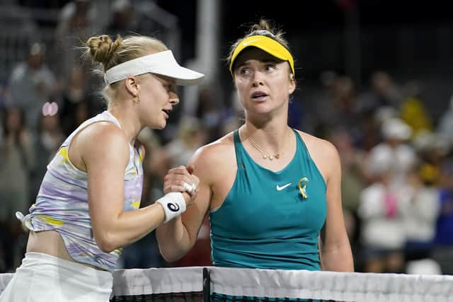 Harriet Dart, of Britain, left, shakes hands with Elina Svitolina, of Ukraine, after Dart defeated Svitolina at the BNP Paribas Open.