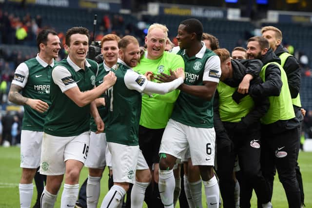 Hibs' stand-in goalkeeper Conrad Logan (centre) is mobbed by his team-mates after the Leith side defeated Dundee United on penalty kicks in the 2016 Scottish Cup semi-final. Photo by Craig Williamson/SNS Group