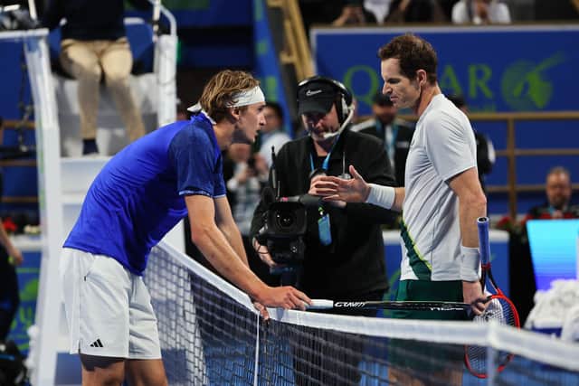 Andy Murray extends his hand to Alexander Zverev after his victory at the Qatar Open. (Photo by KARIM JAAFAR/AFP via Getty Images)