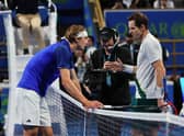 Andy Murray extends his hand to Alexander Zverev after his victory at the Qatar Open. (Photo by KARIM JAAFAR/AFP via Getty Images)