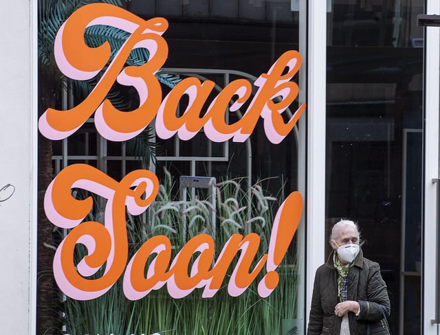 A shopper walks past a window display on Princes Street. Picture: Lisa Ferguson