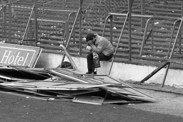 File photo dated 15/04/89 of a young Liverpool fan sitting with his head in his hands after the FA Cup Semi Final game between Liverpool and Nottingham Forest at Hillsborough.