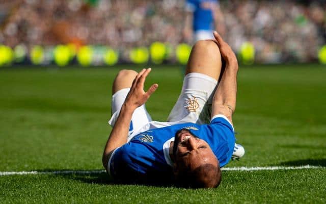Rangers striker Kemar Roofe clutches his right knee in discomfort during last Sunday's Scottish Cup semi-final against Celtic at Hampden. (Photo by Ross MacDonald / SNS Group)