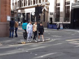 A delivery rider on the pavement in Glasgow. Picture: The Scotsman