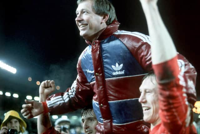 Fergie celebrating the glory of Gothenburg with Doug Rougvie who described the manager thus: "One minute a genius, the next a bully ... he was a genius-bully!"