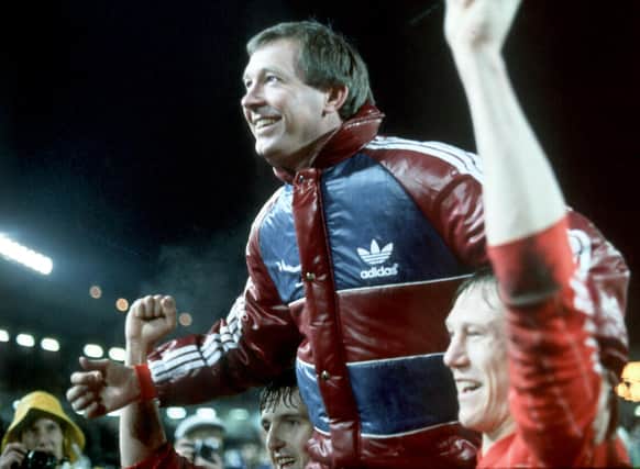Fergie celebrating the glory of Gothenburg with Doug Rougvie who described the manager thus: "One minute a genius, the next a bully ... he was a genius-bully!"