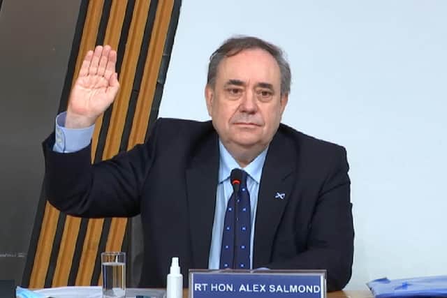 Alex Salmond takes the oath before giving evidence to the Holyrood committee just days before Nicola Sturgeon's appearance