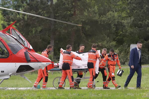 Rescue workers wheel Slovak Prime Minister Robert Fico, who was shot and injured, to a hospital in the town of Banska Bystrica, central Slovakia. Photo: Jan Kroslak/TASR via AP