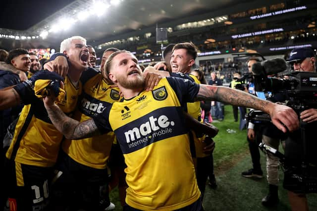 Jason Cummings of the Mariners celebrates winning the 2023 A-League Men's Grand Final match