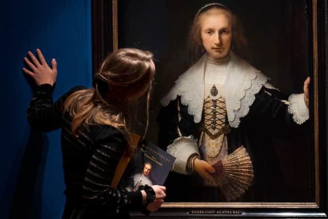 Exhibition curator Isabella Manning examines Rembrandt’s ‘Portrait of Agatha Bas’, one of the most famous paintings in the Royal Collection, ahead of the opening of ‘Masterpieces from Buckingham Palace’ at The Queen’s Gallery, Edinburgh. PIC: David Cheskin / Royal Collection Trust
