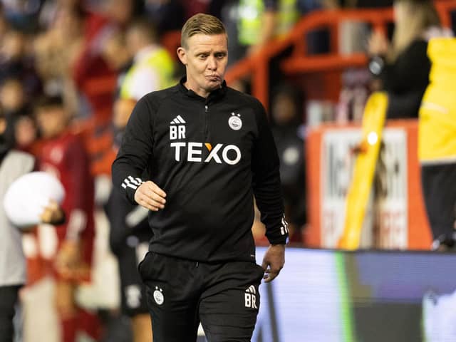 Aberdeen manager Barry Robson looks dejected at full time after the defeat to BK Hacken but can now look forward to group stage football in the Europa Conference League. (Photo by Mark Scates / SNS Group)