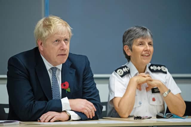 Boris Johnson is seen with Metropolitan Police Commissioner Cressida Dick, who yesterday announced an investigation into alleged lockdown breaches in Downing Street (Picture: Aaron Chown/PA)