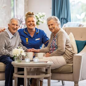Residents with care home colleague at HC-One care home