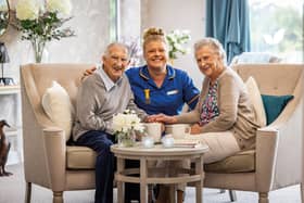 Residents with care home colleague at HC-One care home