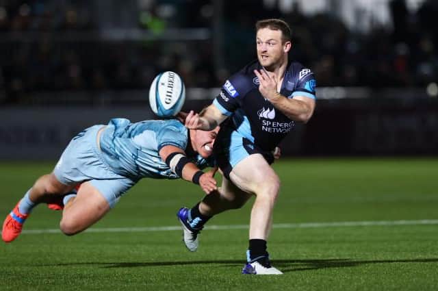 Nick Grigg offloads the ball under pressure. (Photo by Craig Williamson / SNS Group)